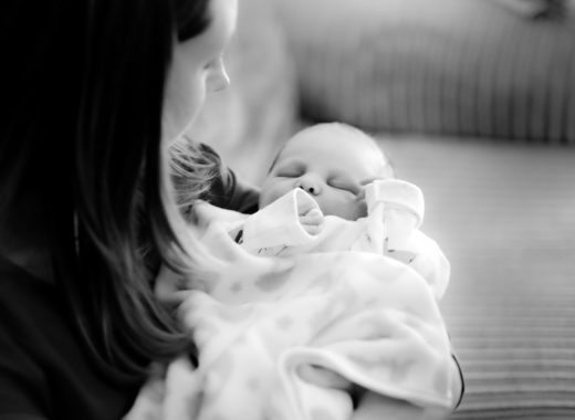 New Mum Helly cradling newborn Ev hours after his birth