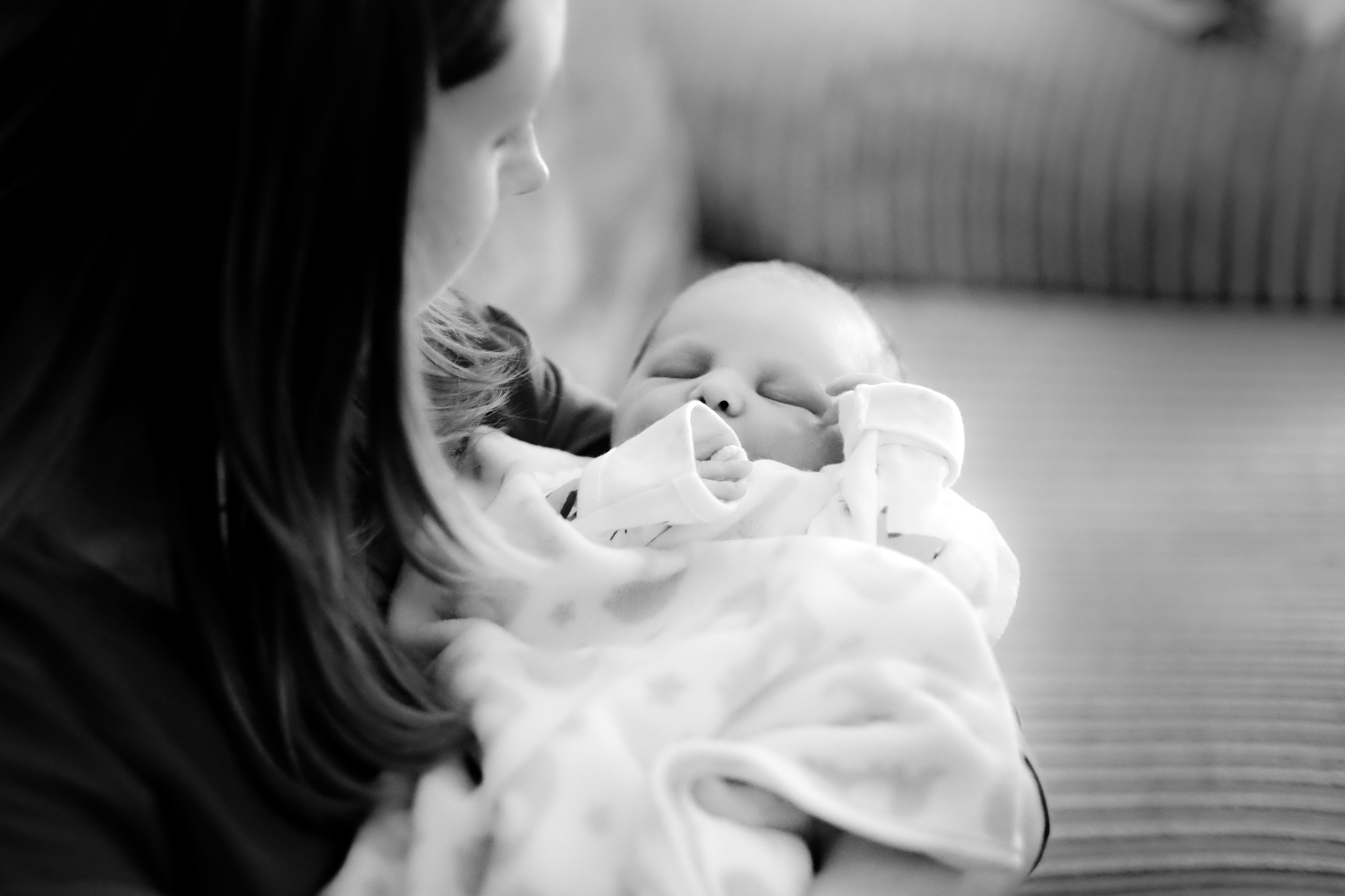 New Mum Helly cradling newborn Ev hours after his birth